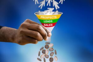 A hand pouring coins into a funnel labeled 'Prospects,' 'Leads,' and 'Sales,' symbolizing the sales process.