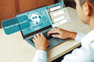 A person interacting with a chatbot on a laptop, showing a chat interface with options and a welcoming message for assistance.