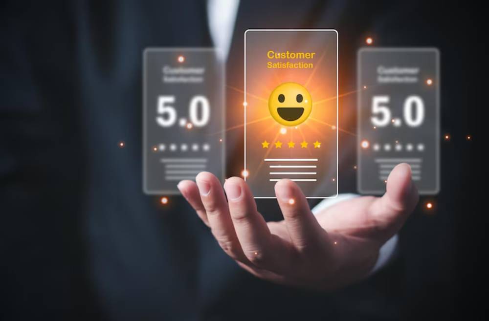 A businessman holds a glowing digital display featuring a happy face icon and customer satisfaction ratings of 5.0 stars.