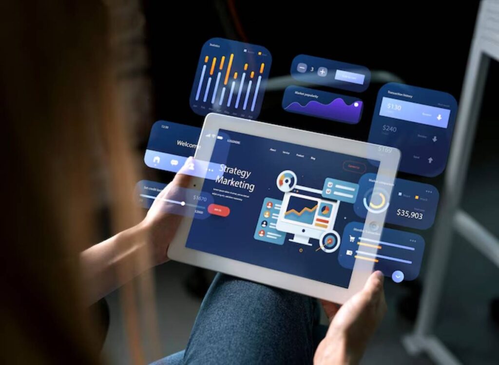 A person holding a tablet displaying a vibrant marketing strategy dashboard with various data widgets and graphs.